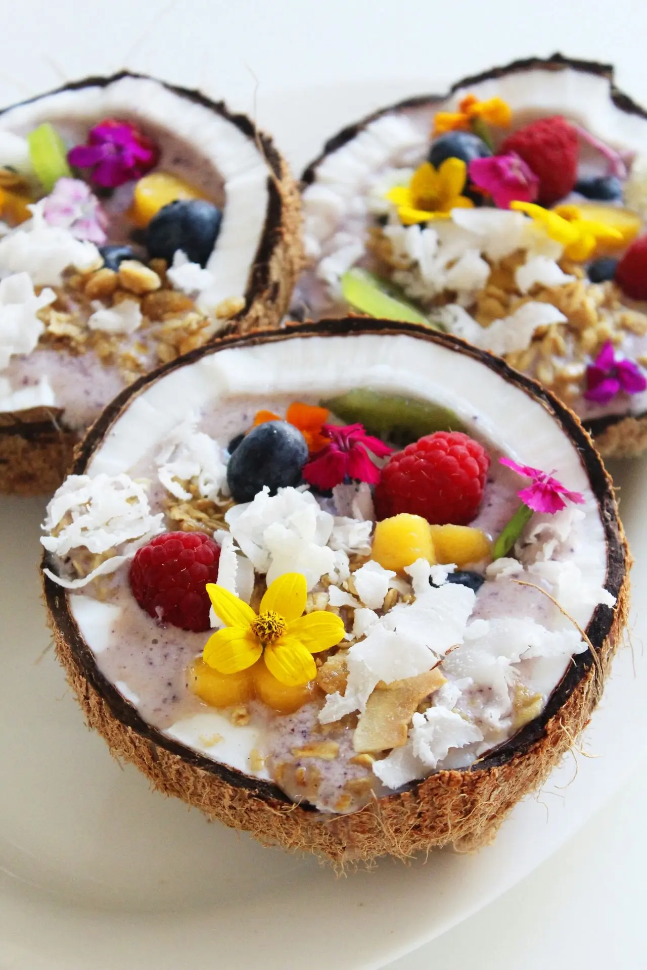 coconut with berries and flowers